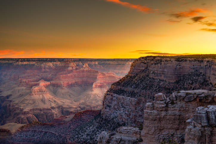 A view of the Grand Canyon as the sun sets.
