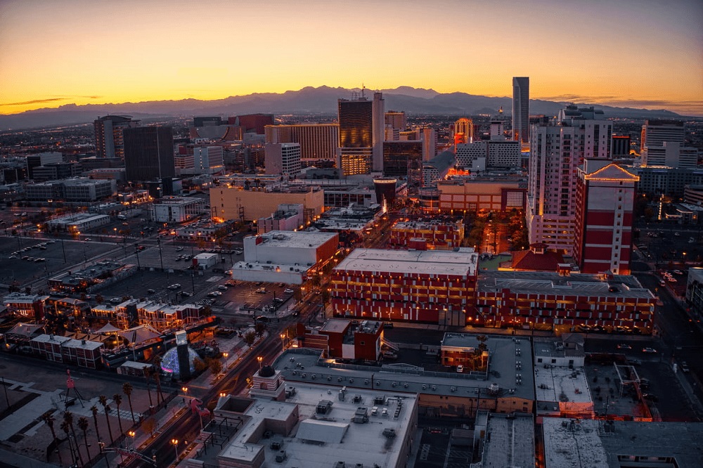 An aerial view of downtown Las Vegas at dusk which homes Las Vegas Fremont Street.