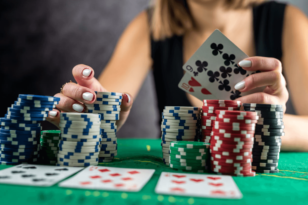 Focus is on a woman gambling at a card table in Las Vegas.