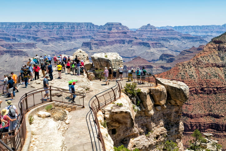 Multiple visitors pictured at the Grand Canyon. 